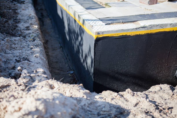 Professional Emergency Waterproofing technician working in Morrisonville, NY